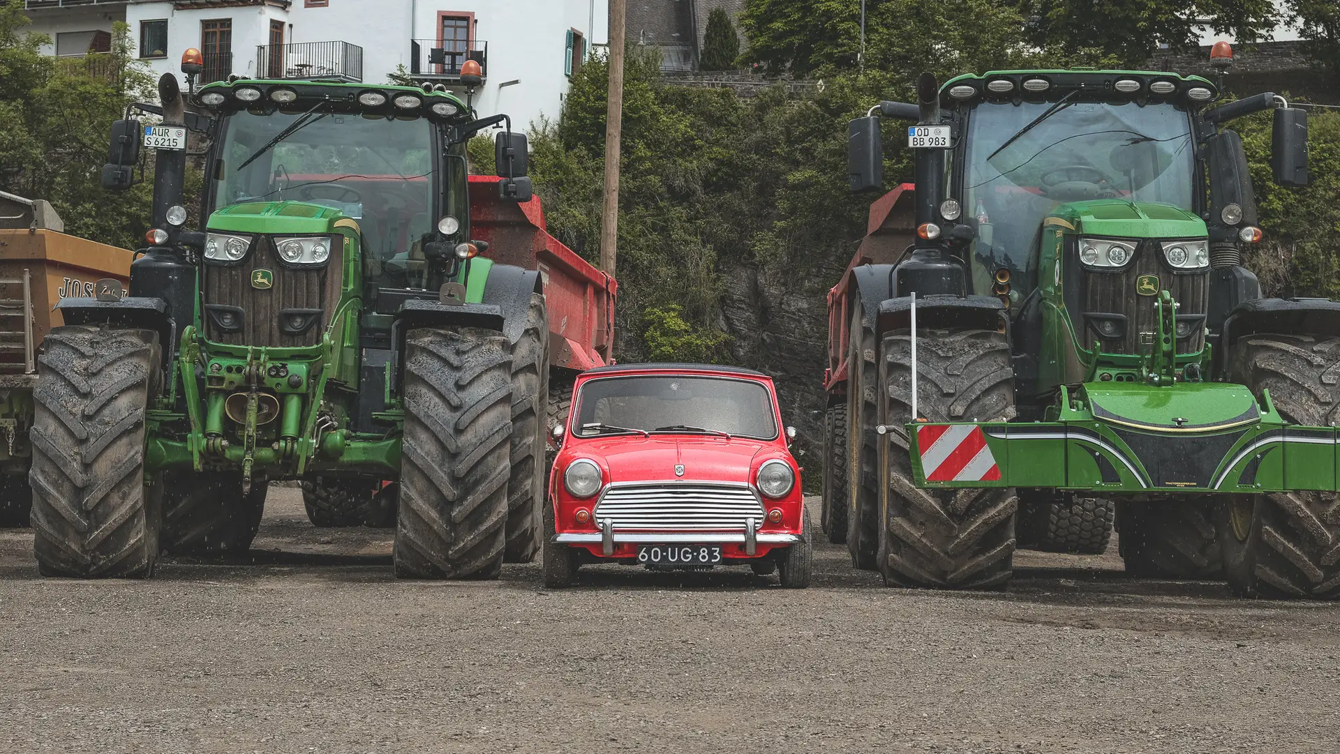 The Mini 1100 Special next to two trucks