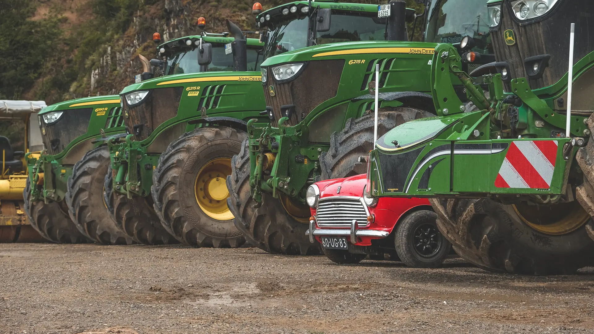 The Mini 1100 Special standing beween several trucks