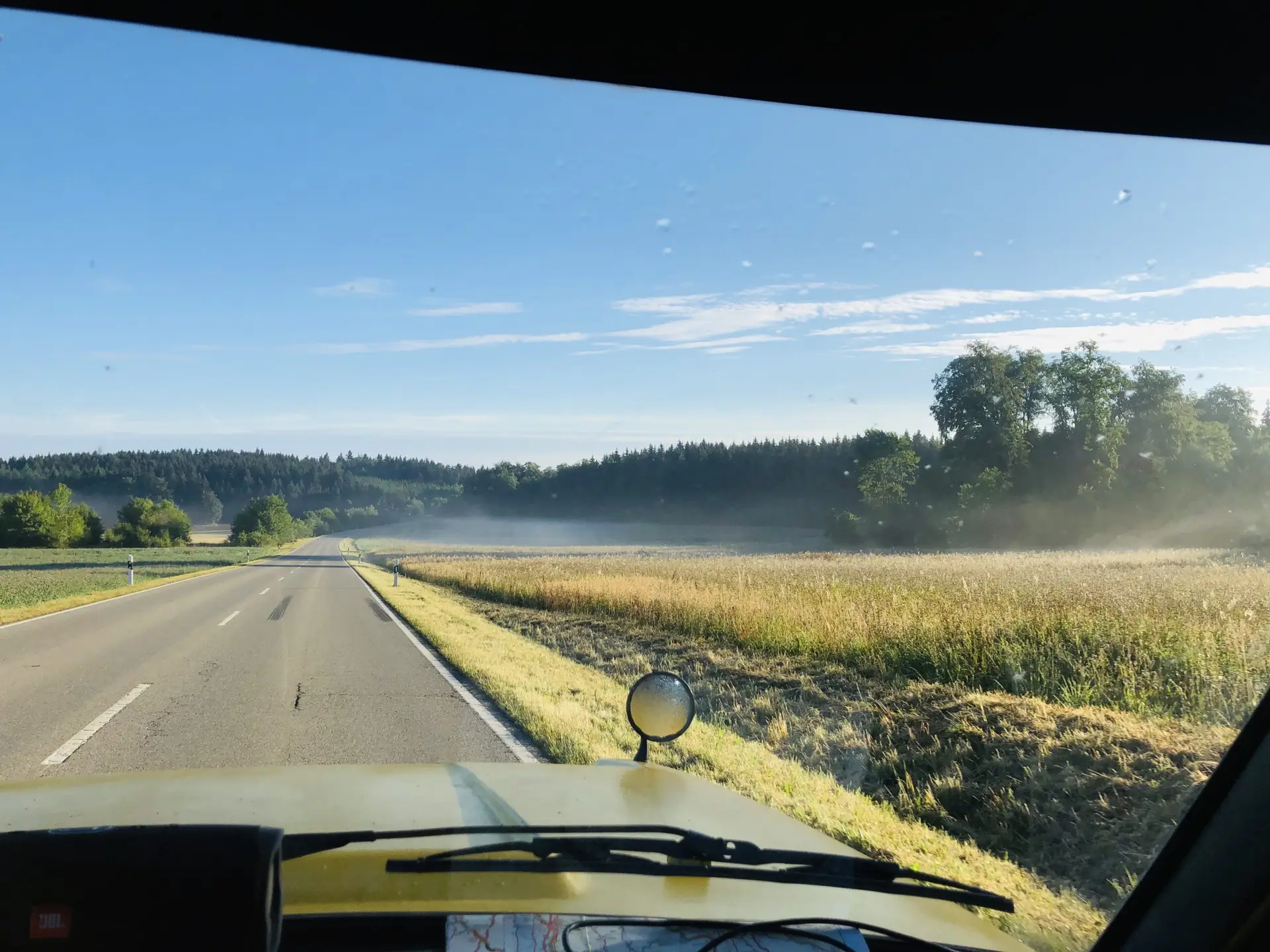 a view from the inside of a Range Rover Suffix C forward, the mirror is shown at the front of the car