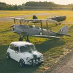 brooks mini classic with a Tiger moth and chipmunk airplane in the background. standing on an open grass field at airport seppe breda