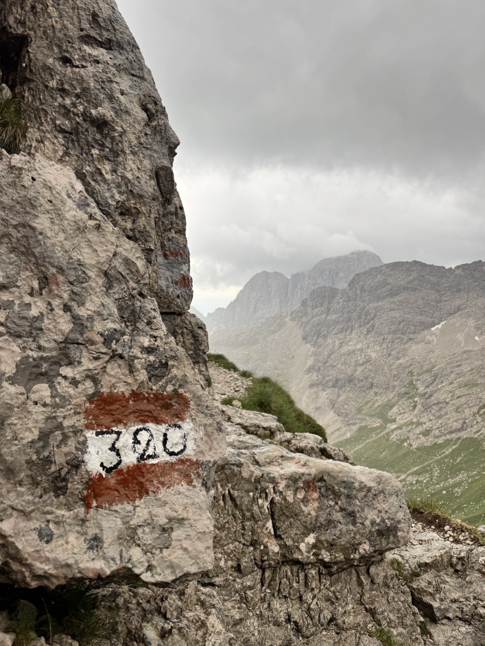 320 route sign in the dolomite mountains